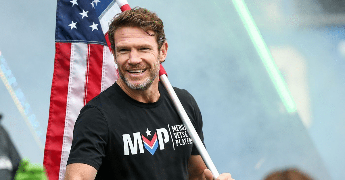 image of Nate Boyer holding Flag